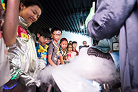 Participants of the Alien Party @ Space Museum learn the structure of a comet through a demonstration.